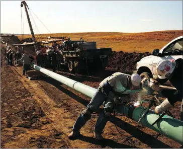  ?? Herald Archive, Bloomberg ?? Costs of using alternativ­e transporta­tion to get around pipelines that are operating at capacity might affect first-quarter results from Calgary oil and gas producers, analysts say.