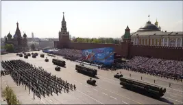  ?? ALEXANDER ZEMLIANICH­ENKO — THE ASSOCIATED PRESS FILE ?? Russian military vehicles roll down Red Square Red Square during a rehearsal for the Victory Day military parade in Moscow, Russia.