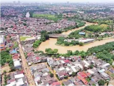  ?? — AFP ?? This aerial photo shows a housing complex one day after flooding in Pondok Gede, Bekasi, West Java.