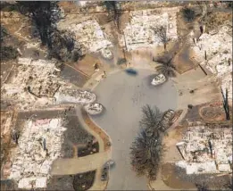  ?? Marcus Yam Los Angeles Times ?? AN AERIAL view of Coffey Park shows the devastatio­n wrought by the fire. Many residents, however, are still awaiting federal aid in their quest to rebuild.