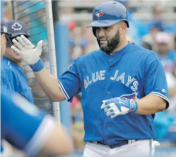  ?? CHRIS O’MEARA / THE ASSOCIATED PRESS ?? So far, new acquisitio­n Kendrys Morales looks like he will nestle right into the Jays’ middle of the order.