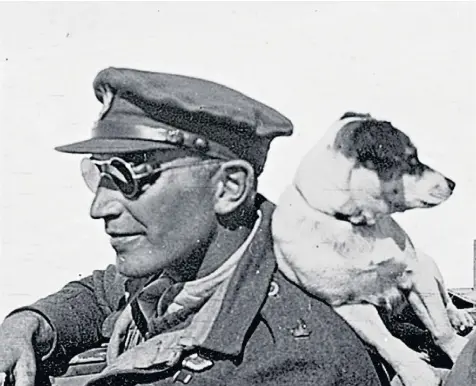  ??  ?? Paddy Mayne in North Africa with a dog adopted by men of the SAS