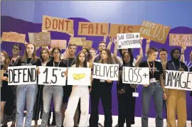  ?? Nariman El-Mofty Associated Press ?? YOUTH ACTIVISTS call on world leaders to maintain policies that limit global warming at the COP27 climate summit in Egypt on Nov. 19.