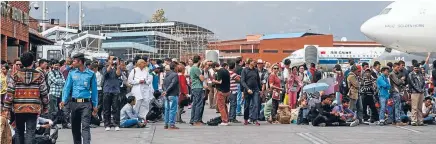  ??  ?? Tourists gather at Nepal's Tribhuvan Internatio­nal Airport