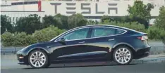  ?? — Reuters ?? First production model of Tesla Model 3 out the assembly line in Fremont, California, US is seen in this undated handout photo from Tesla.