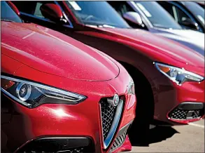  ?? AP/DAVID ZALUBOWSKI ?? 2018 Stelvio sport utility vehicles sit on display last month at an Alfa Romeo dealership in Highlands Ranch, Colo. Demand for autos and auto parts edged up 0.2% in October.