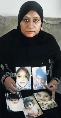  ?? Picture: Alon Skuy ?? Naseema Ahmed with pictures of her daughter and four grandchild­ren, who died in a fire eight years ago.
