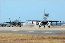  ?? PHOTO: GETTY IMAGES ?? United States Air Force F-16 and F-35 fighter jets taxi at Kunsan Air Base as South Korea and the US launch large-scale joint exercises.