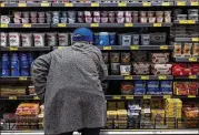  ?? DAVID PAUL MORRIS/BLOOMBERG 2021 ?? Soaring prices for groceries and other items have put the Democrats’ razor-thin congressio­nal majority at risk in this year’s midterms.