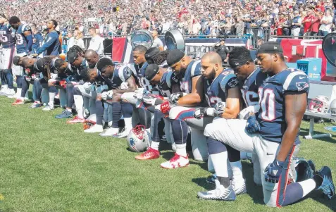  ?? Picture: GETTY IMAGES ?? PROTEST: New England Patriots kneel during the national anthem before a game against the Houston Texans.