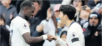  ?? REUTERS ?? SON HEUNG-MIN celebrates scoring Tottenham’s third goal against Leicester with Moussa Sissoko at Wembley yesterday. |