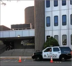  ?? SUBMITTED IMAGE ?? Two Trenton police officers sit inside a SUV outside of Monday’s school board meeting at the Board of Education building.