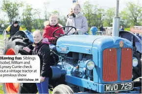  ??  ?? Having fun Siblings Isobel, William and Lynsey Currie check out a vintage tractor at a previous show
160515show_04