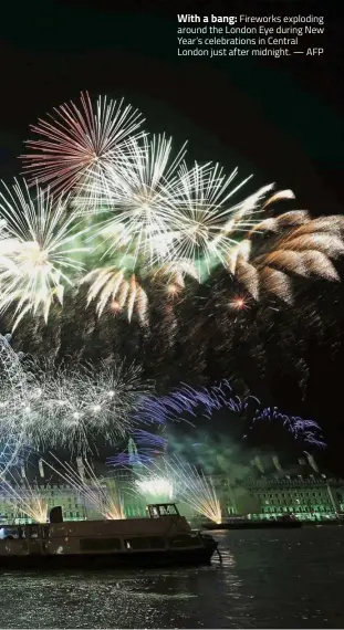  ?? AFP ?? With a bang: Fireworks exploding around the London Eye during New Year’s celebratio­ns in Central London just after midnight. —