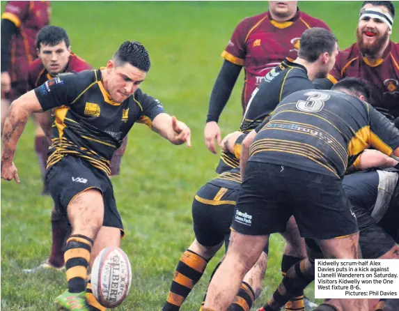  ??  ?? Kidwelly scrum-half Alex Davies puts in a kick against Llanelli Wanderers on Saturday. Visitors Kidwelly won the One West fixture 8-6.Pictures: Phil Davies