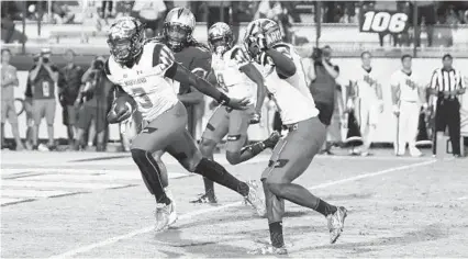  ?? CHARLES KING/ORLANDO SENTINEL ?? Maryland freshman quarterbac­k Tyrrell Pigrome scored the winning touchdown in the second overtime of the Terps’ victory over Central Florida last season. Much has changed since then for the Terps, including Pigrome injuring his knee in the first game...