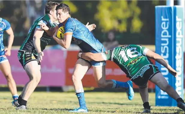  ?? Picture: ALIX SWEENEY ?? GREAT EXPECTATIO­NS: Northern Prides' Evan Child takes on the Townsville Blackhawks defence during an under-20s match at Jack Manski Oval.