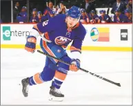  ?? Mike Stobe / NHLI via Getty Images ?? The Islanders’ Ross Johnston skates against the Flyers on April 3 in New York.