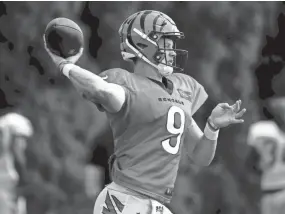  ?? ALBERT CESARE/THE ENQUIRER ?? Prior to tearing his ACL, rookie quarterbac­k Joe Burrow was on pace to break the Bengals’ single-season passing record.