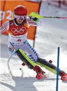  ?? AP Photo/Morry Gash ?? ■ Mikaela Shiffrin of the United States skis in the first run of the women’s slalom Friday at the 2018 Winter Olympics in Pyeongchan­g, South Korea. Shiffrin, the gold medalist in the 2014 Games, came in fourth.