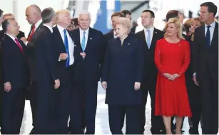  ?? (Kevin Coombs/Reuters) ?? US PRESIDENT Donald Trump adjusts his jacket after pushing past Montenegro Prime Minister Dusko Markovic at the NATO summit in Brussels last week.