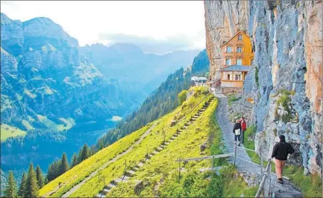  ?? CAMERON HEWITT/RICK STEVES’ EUROPE ?? High above the town of Appenzell, Switzerlan­d’s Ebenalp summit is home to a family-run hut with cheap dorm beds and a fantastic view.