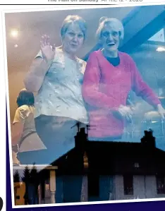  ??  ?? IN THIS TOGETHER: Isla Douglas and one of the residents wave from a window at St David’s care home in Forfar, Angus