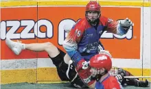  ?? CLIFFORD SKARSTEDT EXAMINER ?? Peterborou­gh Century 21 Lakers’ Robert Hope flattens a Cobourg Kodiaks player along the boards on Thursday at the Memorial Centre.