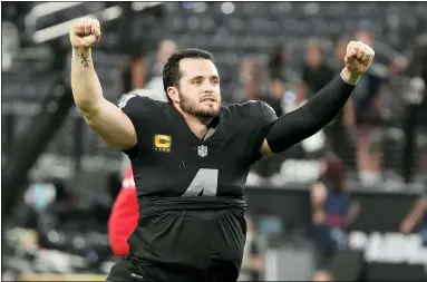  ?? RICK SCUTERI — THE ASSOCIATED PRESS ?? The Raiders’ Derek Carr celebrates after defeating the Ravens on Sept. 13 in Las Vegas.