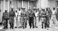  ?? PHOTO: PTI ?? Security personnel keep vigil during curfew imposed following communal clashes in Muzaffarna­gar