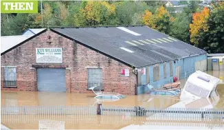  ?? ASHLEY CROWDEN ?? Flooding outside Ken Williams Motors in Carmarthen...