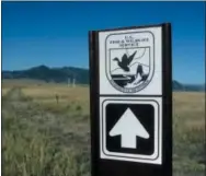  ?? DAN ELLIOTT — THE ASSOCIATED PRESS ?? A sign marks a trail on the Rocky Flats National Wildlife Refuge outside Denver on Saturday, the first day the refuge was open to the public.