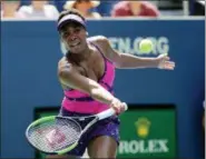  ?? FRANK FRANKLIN II — THE ASSOCIATED PRESS ?? Venus Williams returns a shot to Camila Giorgi during the second round of the U.S. Open tennis tournament, Wednesday in New York.