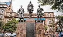  ?? Brian Inganga / Associated Press ?? Pedestrian­s walk past the the African Memorial, dedicated to African military who died in the World Wars, in Nairobi, Kenya.