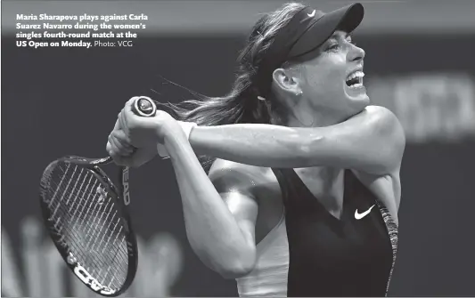  ?? Photo: VCG ?? Maria Sharapova plays against Carla Suarez Navarro during the women’s singles fourth-round match at the US Open on Monday.