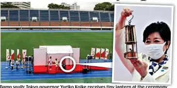  ??  ?? Damp squib: Tokyo governor Yuriko Koike receives tiny lantern at the ceremony