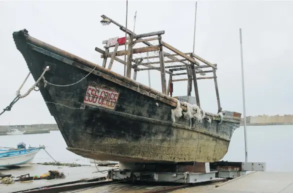  ?? KYODO NEWS VIA THE ASSOCIATED PRESS ?? A ship in Japan’s Wajima, Ishikawa prefecture, after it was found off Noto Peninsula. At least 11 wooden boats carrying decomposin­g bodies were found in the past month.