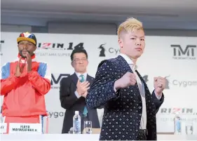  ?? — AFP photo ?? This handout photograph taken by Rizin Fighting Federation on November 5, 2018 shows Japanese kickboxer Tenshin Nasukawa (R) posing during a press conference in Tokyo to announce his fight with US boxer Floyd Mayweather Jr.