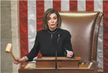  ?? Saul Loeb / AFP via Getty Images ?? House Speaker Nancy Pelosi said the articles of impeachmen­t would not be sent to the Senate unless ‘a fair trial’ is promised.