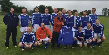  ??  ?? Taghmon United Over-35 manager Willie Furlong and his team being presented with a new set of jerseys by Jimmy Doran of James Doran & Son, Plastering & Building Contractor­s - specialisi­ng in external insulation.