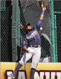  ?? CURTIS COMPTON/CURTIS.COMPTON@AJC.COM ?? Braves right fielder Phillip Ervin can’t make the play on a triple hit by Pirates third baseman Ke’bryan Hayes in Thursday’s 6-1 loss in Bradenton, Florida.