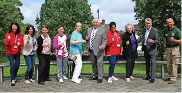  ?? ?? Top tourist attraction­s in Dudley borough are gearing up to welcome the Birmingham 2022 Queen’s Baton Relay. From left to right: Kate Jones (Red House Glass Cone), Carolyn Sankey (Black Country Living Museum), Nicola Beckley (Red House Glass Cone), Sgt.adam Sefton, Sue Hannaford (Halesowen and Rowley Regis Rotary Club), Councillor Patrick Harley, Jane Lamine (Red House Glass Cone), Pamela Arrowsmith (Halesowen and Rowley Regis Rotary Club), Jonathan Poole (Merry Hill), Jon Brown (Dudley Zoo and Castle).