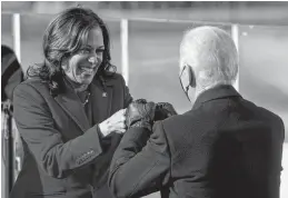  ?? REUTERS ?? Kamala Harris bumps fists with U.S. President-elect Joe Biden, after she was sworn in as vice-president of the United States during the inaugurati­on on the West Front of the U.S. Capitol in Washington.