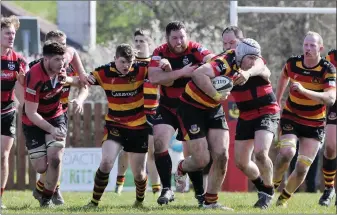  ??  ?? Kuba Wojtkowicz takes on the Tullamore defence in Hamilton Park.