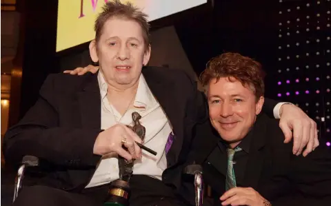  ??  ?? TRIBUTE: Shane MacGowan with Aidan Gillen, who presented his award at the Ivor Novello ceremony. All photos: Mark Allan