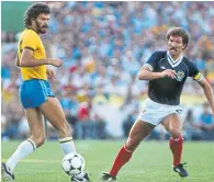  ?? ?? Graeme Souness up against Brazil’s Socrates in 1982