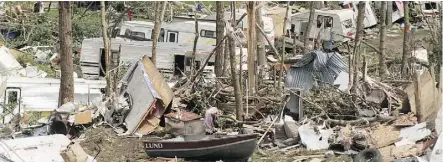  ?? WALTER TYCHNOWICZ ?? The view was not pretty among the wreckage in the aftermath of the Pine Lake tornado, which killed 27 and injured 600 on July 14, 2000, marking it as one of the worst twisters in Canadian history.