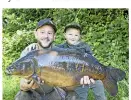  ??  ?? The bigger of two mirrors went 35lb 5oz for Paul Heseltine and his young son Rylen.