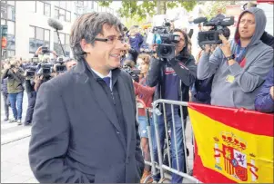  ?? AP PHOTO ?? Ex-Catalonian President Carles Puigdemont arrives for a press conference in Brussels, Tuesday. A Spanish judge has issued an internatio­nal arrest warrant for Puigdemont and several of his aides.