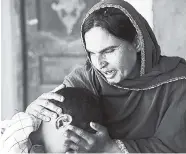  ?? AP ?? In this picture taken on May 4, Kausar Parveen comforts her child who was allegedly raped by a mullah, or religious cleric, in Kehror Pakka, Pakistan.